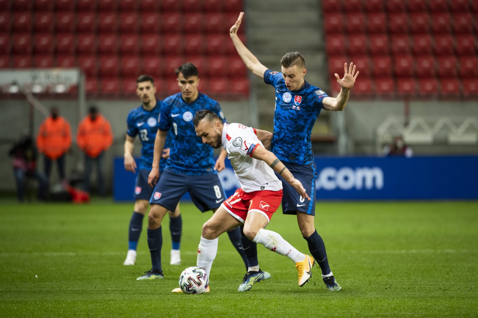 Martin Koscelník (Slovensko), Dávid Strelec (Slovensko), Teddy Teuma (Malta) a Ján Greguš (Slovensko) v zápase H-skupiny kvalifikácie MS 2022 vo futbale Slovensko - Malta v Trnave 27. marca 2021. Foto: Jaroslav Novák/TASR