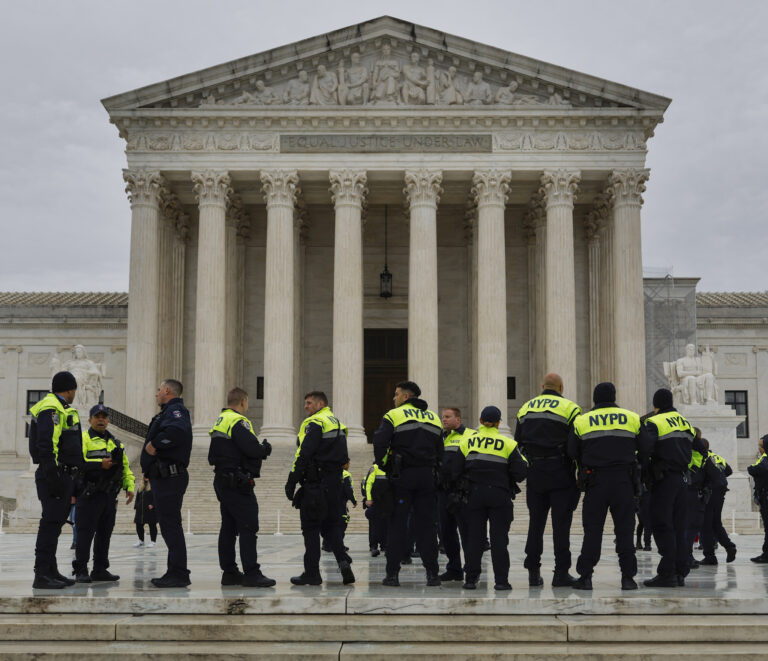 New York City police officers stand in front of the Supreme Court while patrolling prior to the inauguration of Donald Trump. Photo: Kevin Carter / Getty Images