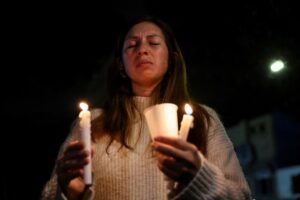 A woman prays.
