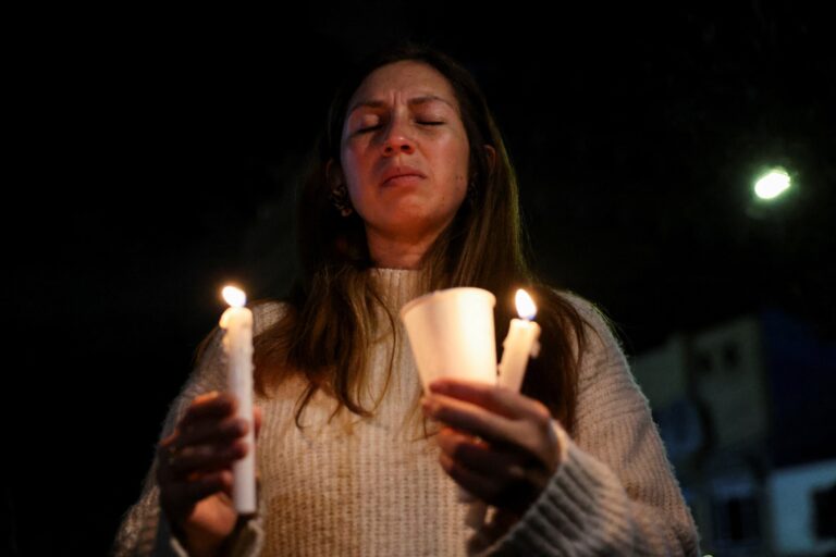 A woman prays.