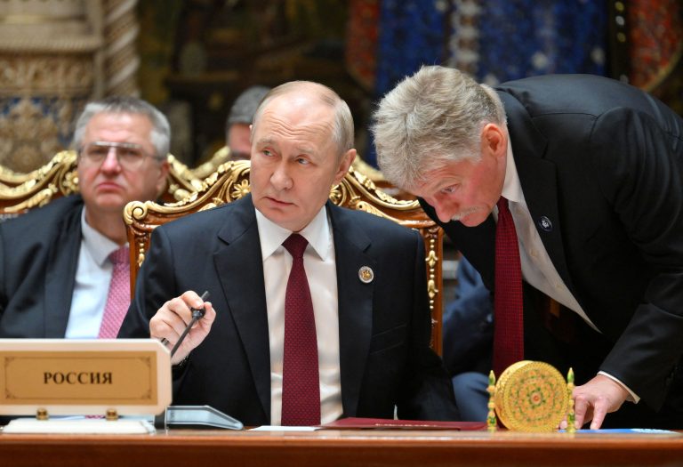 Vladimir Putin and Dmitry Peskov. Photo: Sputnik/Grigory Sysoev/Pool/Reuters