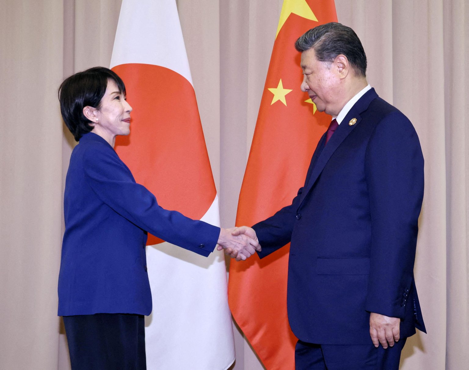 Sanae Takaichi and Xi Jinping. Photo: Kyodo/Reuters