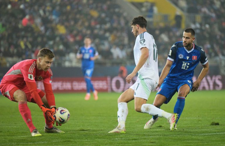 Vpravo Dávid Hancko a vľavo Peacock Farrell (Severné Írsko) počas zápasu  A-skupiny. Foto: František Iván/TASR