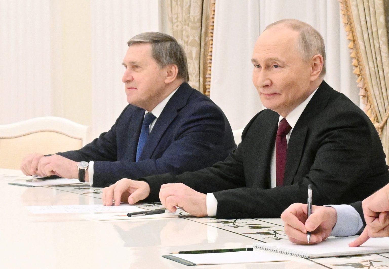 Vladimir Putin and Yuri Ushakov. Photo: Kristina Kormilitsyna/Pool via Reuters