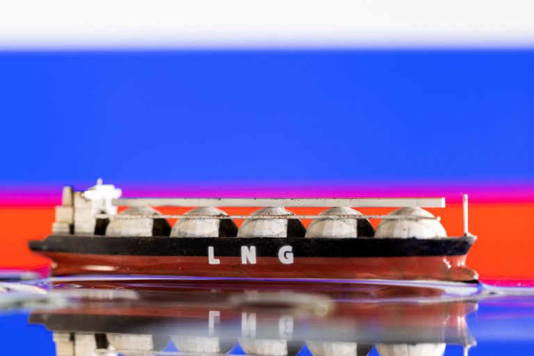 Illustrative photo of an LNG tanker model in front of the Russian flag. Photo: Dado Ruvic/Reuters