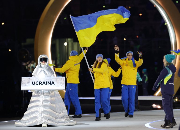 A woman from Russia carried Ukraine's flag at the Olympic Games