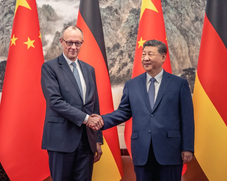 German Chancellor Friedrich Merz shakes hands with Chinese President Xi Jinping. Photo: Michael Kappeler/Reuters