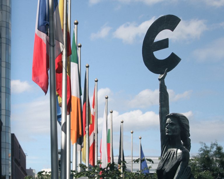 A statue holding the euro sign outside the European Parliament in Brussels – every euro that passes through the state loses value. Photo: Mark Renders/Getty Images