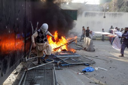 Crowd in Pakistan breaks through wall of US consulate, deaths reported