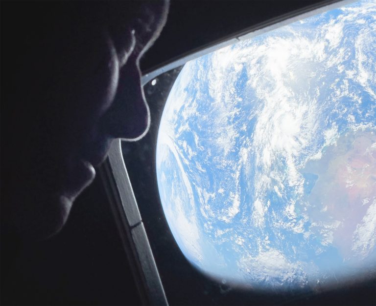 Artemis II mission commander Reid Wiseman looks back at Earth from the window of the Orion spacecraft during the flight to the Moon. Photo: NASA via Getty Images