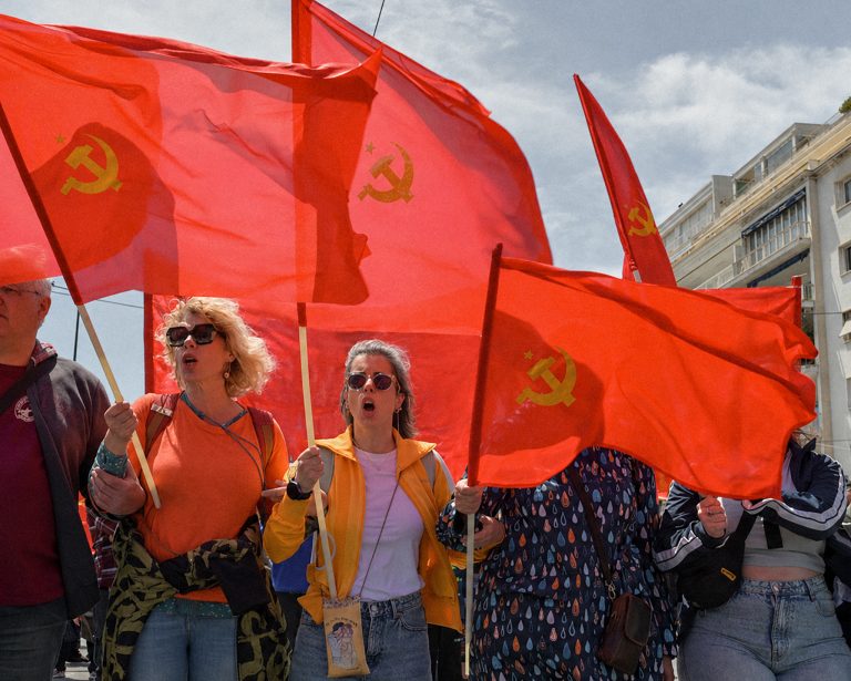 Protesters carry communist flags during a May Day rally in Athens, Greece, 1 May. Photo: Milos Bicanski/Getty Images