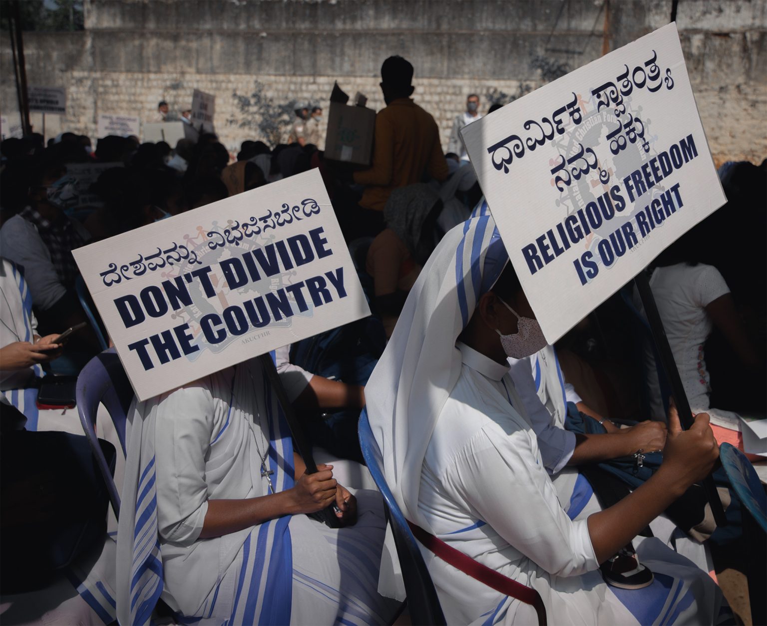Christian nuns protest in India, holding signs calling for religious freedom and warning against division, amid growing concern over state pressure on church-linked institutions. Photo: Abhishek Chinnappa/Getty Images