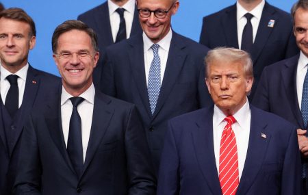 US President Donald Trump stands beside NATO Secretary General Mark Rutte during a NATO summit in The Hague. Photo: Claudia Greco/Reuters/File Photo