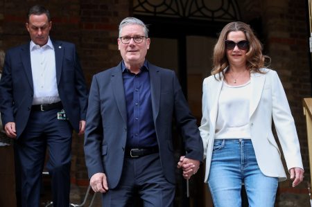 Keir Starmer with his wife, Victoria. Photo: Hannah McKay/Reuters