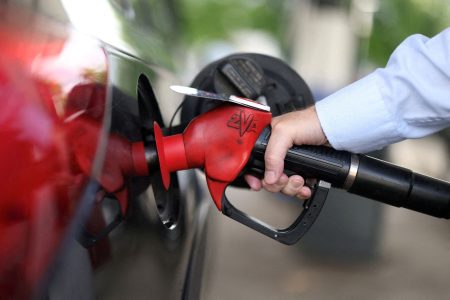 A man pumps fuel.