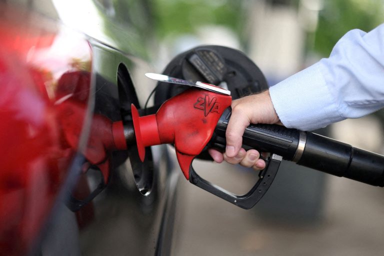 A man pumps fuel.