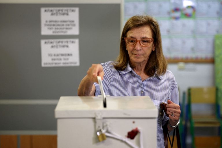 A woman casts her vote during parliamentary elections at a polling station in Nicosia, Cyprus.