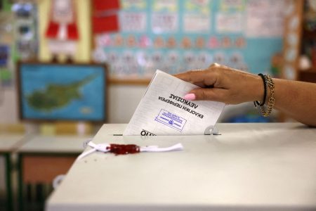 A woman casts her vote during parliamentary elections.