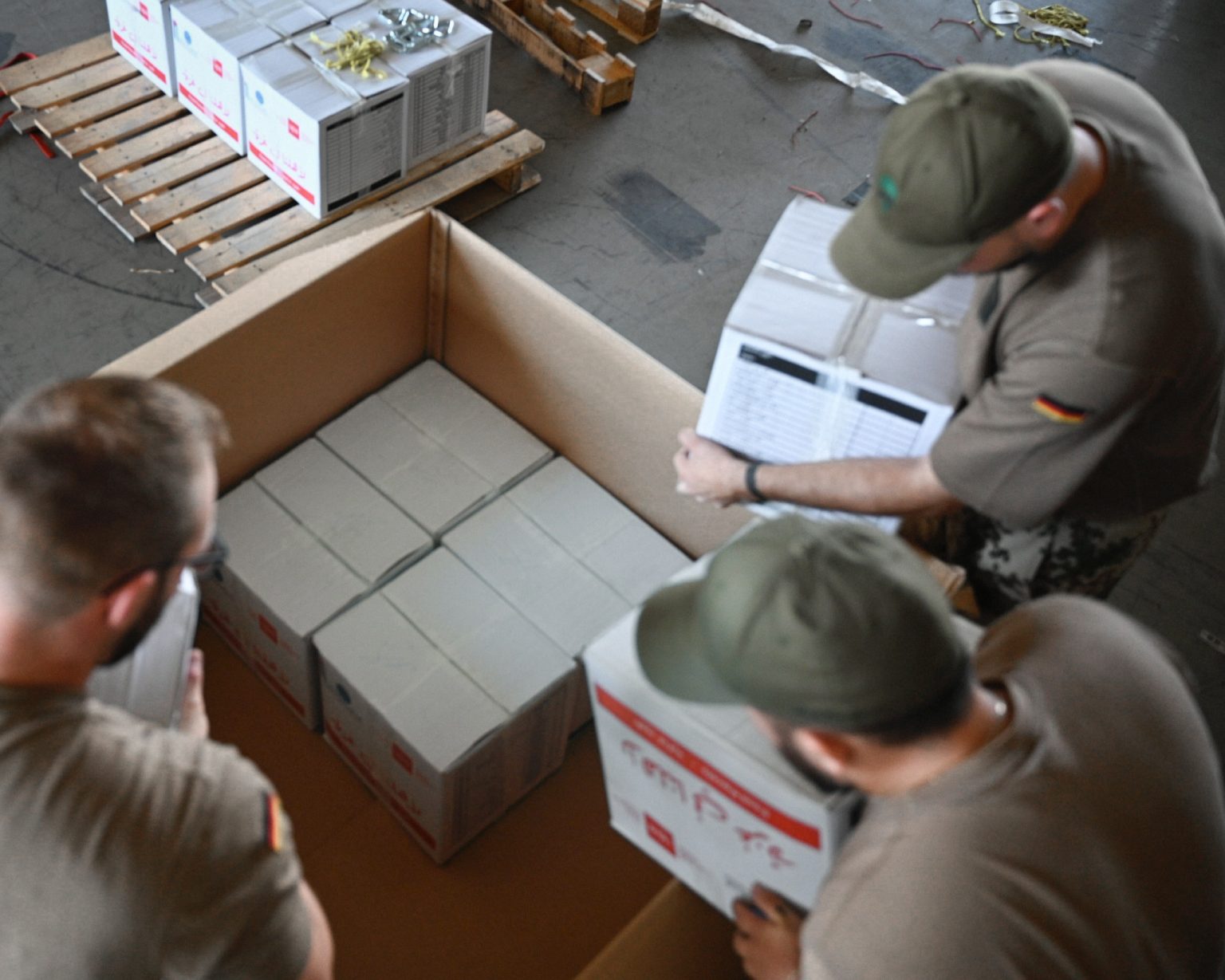 German Armed Forces personnel prepare humanitarian aid.