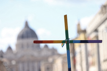 Cross in LGBT colors.
