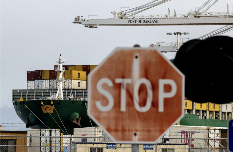 A cargo ship loaded with containers at the port of Oakland, California. Photo: Carlos Barria/Reuters