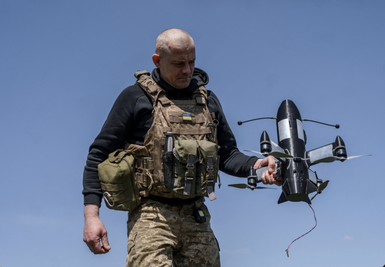 A Ukrainian soldier with a drone. Photo: Serhii Korovainyi/Reuters