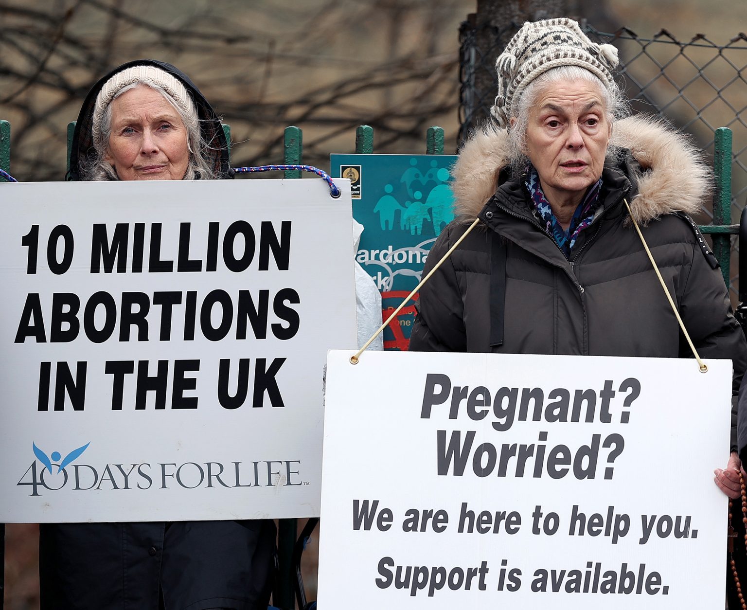 Pro-life demonstrators reach out to women at a clinic.