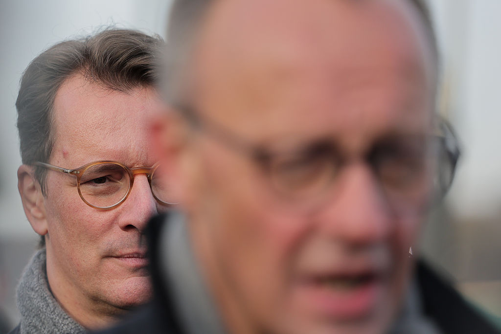 Hendrik Wüst stands behind Friedrich Merz at the opening of the Rahmedetal Bridge in North Rhine-Westphalia, with Berlin already whispering about who might one day stand in front. Photo: Rolf Vennenbernd/dpa/picture alliance via Getty Images