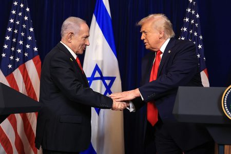 US President Donald Trump shakes hands with Israeli Prime Minister Benjamin Netanyahu during a press conference at his Mar-a-Lago club on 29 December 2025 in Palm Beach, Florida.