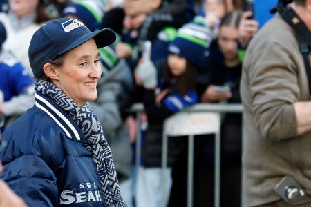 Seattle Mayor Katie B. Wilson celebrates with fans.
