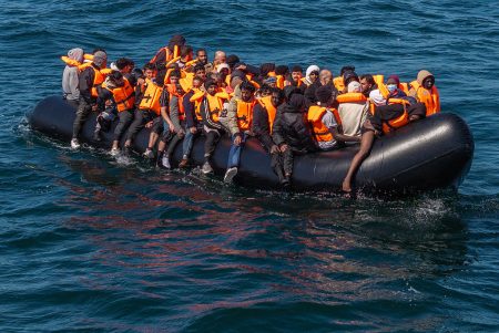 Migrants cross the English Channel in a small boat off Dover. Photo: Dan Kitwood/Getty Images