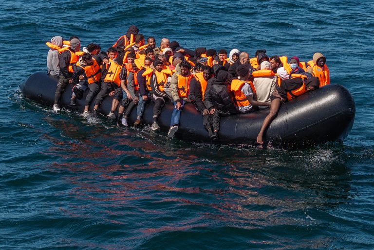 Migrants cross the English Channel in a small boat off Dover. Photo: Dan Kitwood/Getty Images