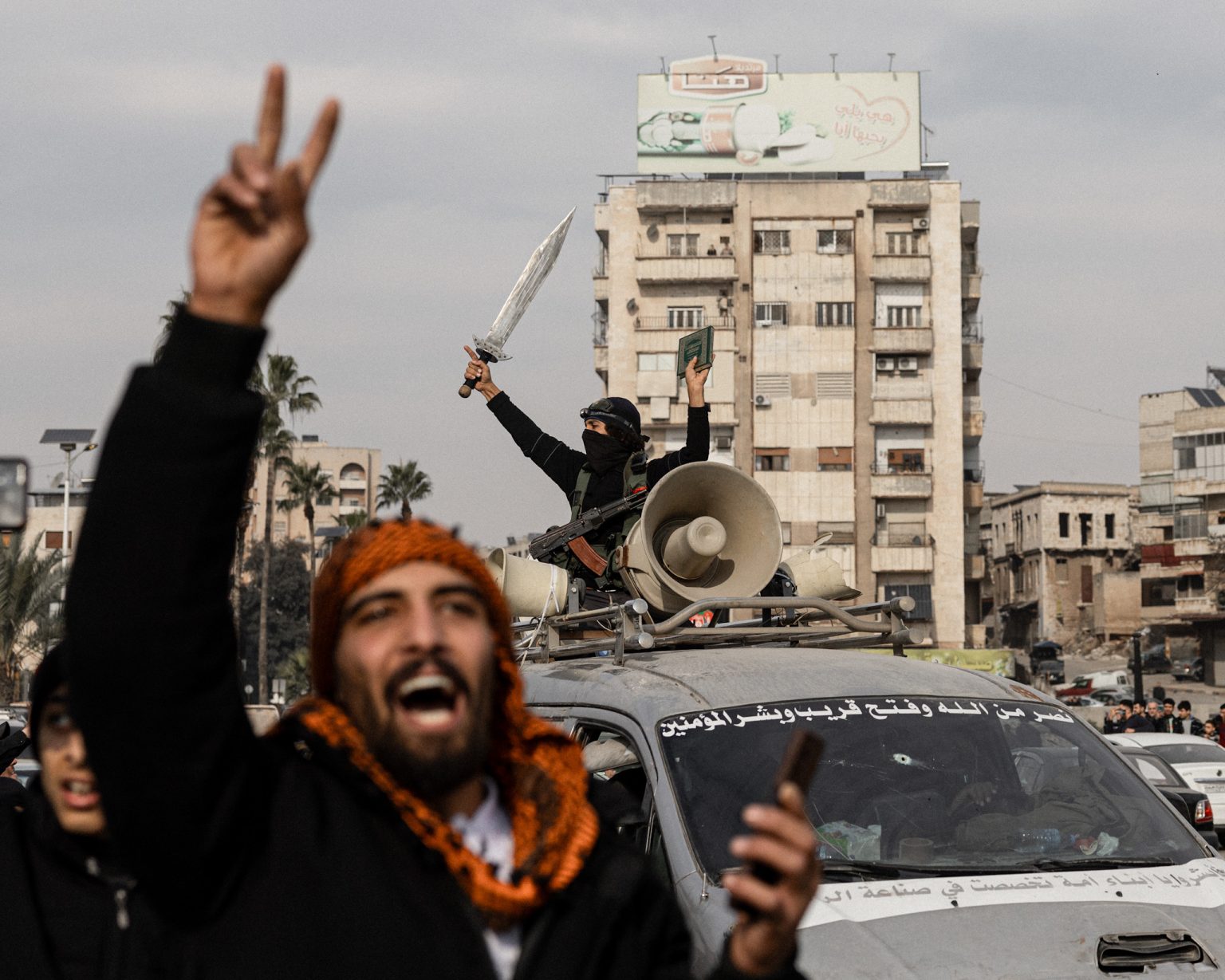 Soldiers celebrating in the city of Hama.