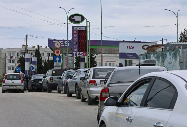 Cars line up for fuel at a gas station in Sevastopol.