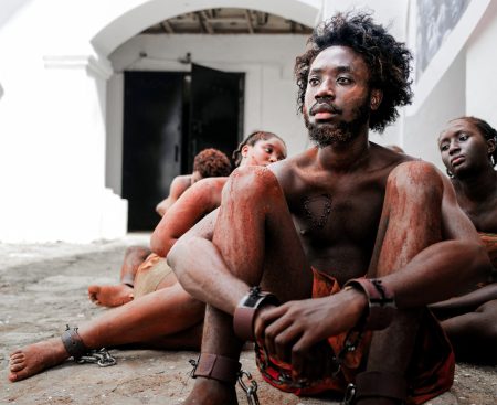 Performers reenact the trans-Atlantic slave trade.