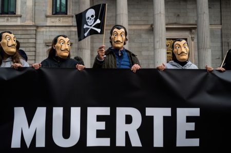 Protesters in Dali masks outside the Spanish Parliament.