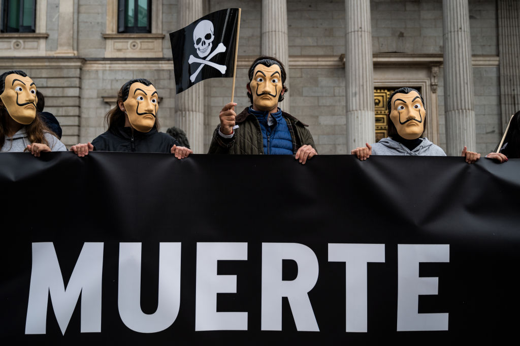 Protesters in Dali masks outside the Spanish Parliament.