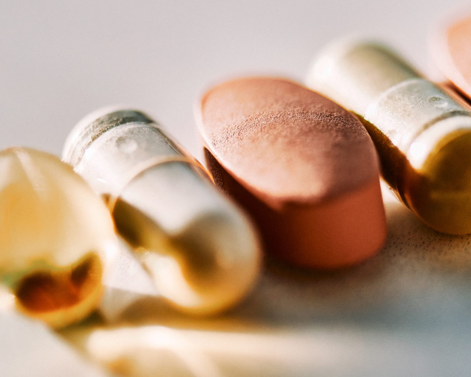 Close-up of various pills and capsules.