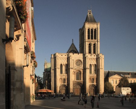 Cathedral Basilica of Saint Denis with the town hall in foreground.
