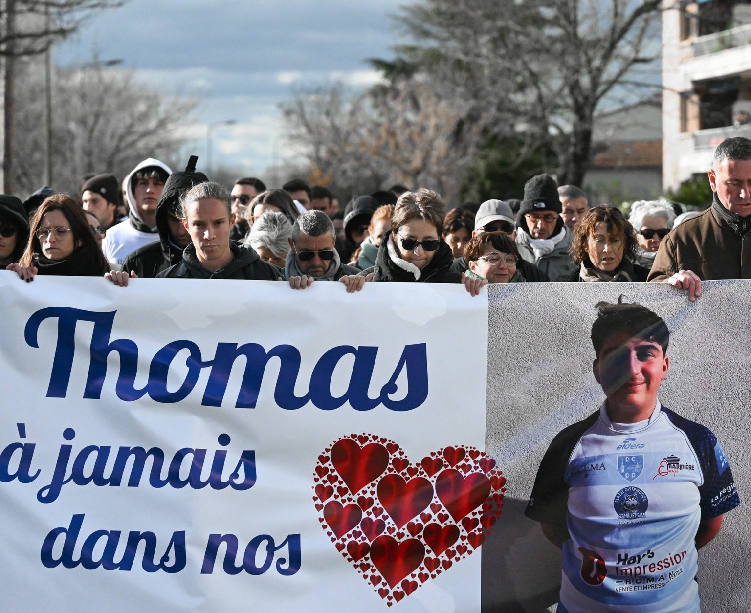 Mourners at a march for Thomas Perotto in Romans-sur-Isère.