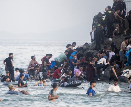 People of Maghrebi origin crossing into Ceuta.