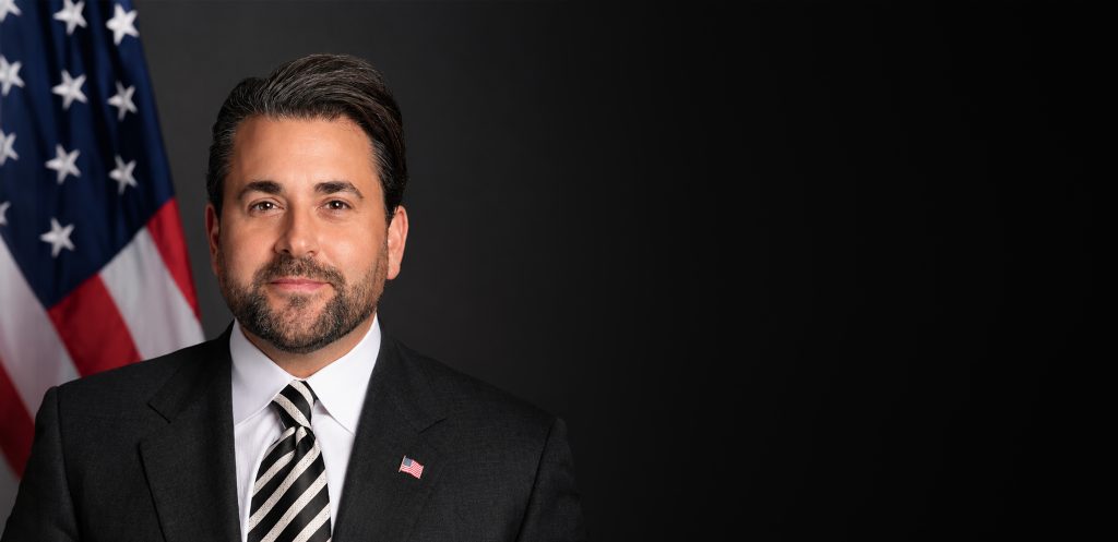 Nick Adams Has One Job: Sell America