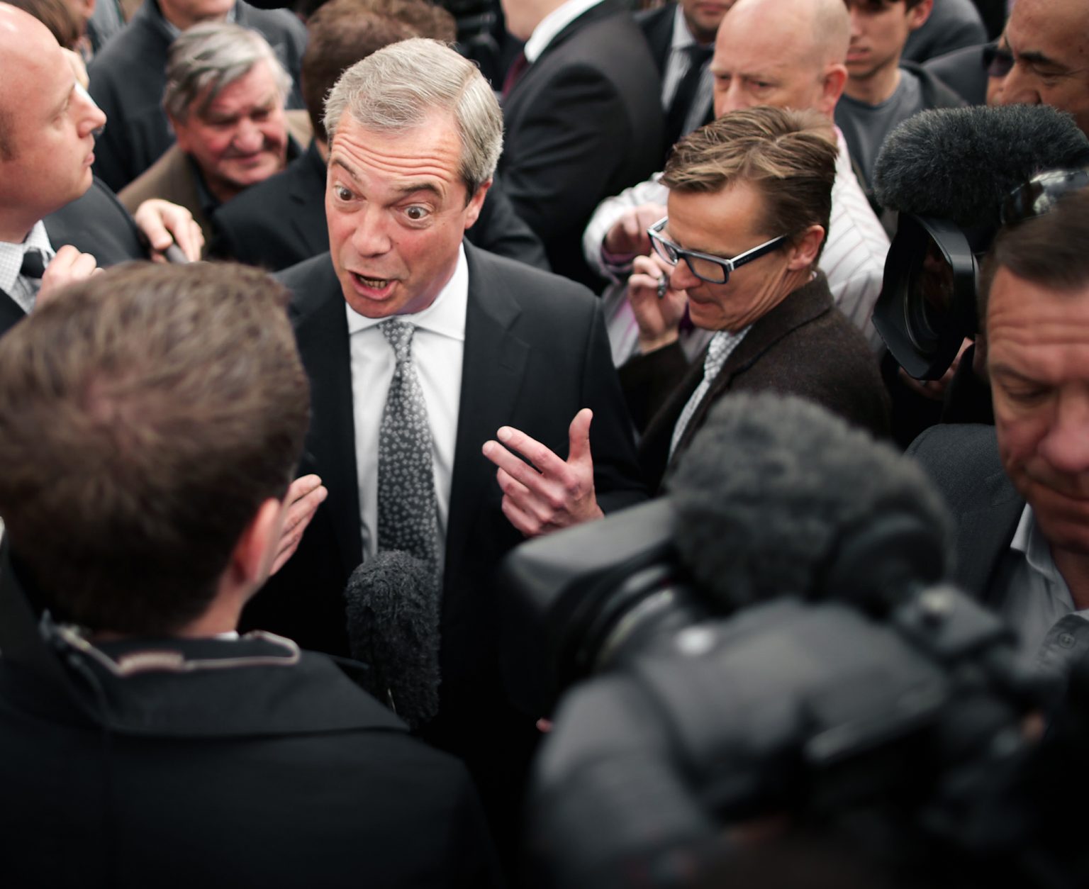 Nigel Farage faces reporters after resigning.
