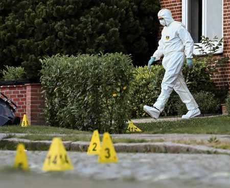 Forensic expert at the scene of the Stade massacre.