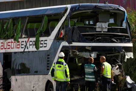 Emergency workers at the damaged coach after the crash near Wezep.