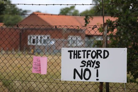 A “Thetford Says No!” sign at RAF Barnham, where the government is considering housing around 1,250 asylum seekers as part of its move away from hotels.