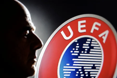 Silhouette of Gianni Infantino and UEFA logo.