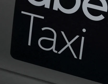 Taxi sign on a car.