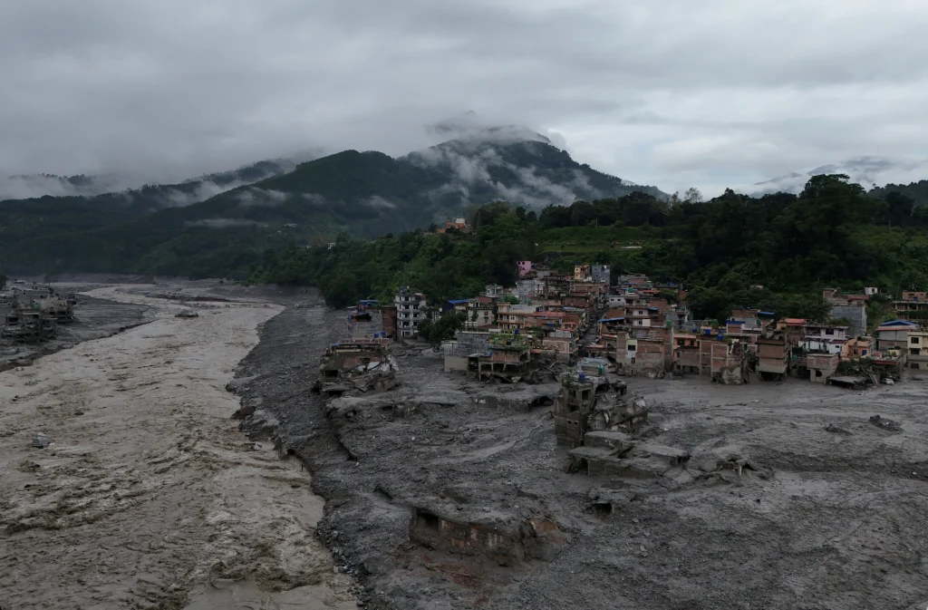 Mud covering properties following a flash flood in Trishuli. Photo: REUTERS/Navesh Chitrakar
