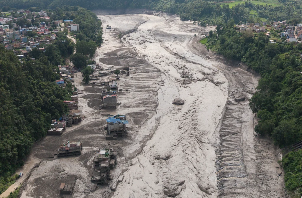 Mud covering properties following a flash flood in Trishuli. Photo: REUTERS/Navesh Chitrakar